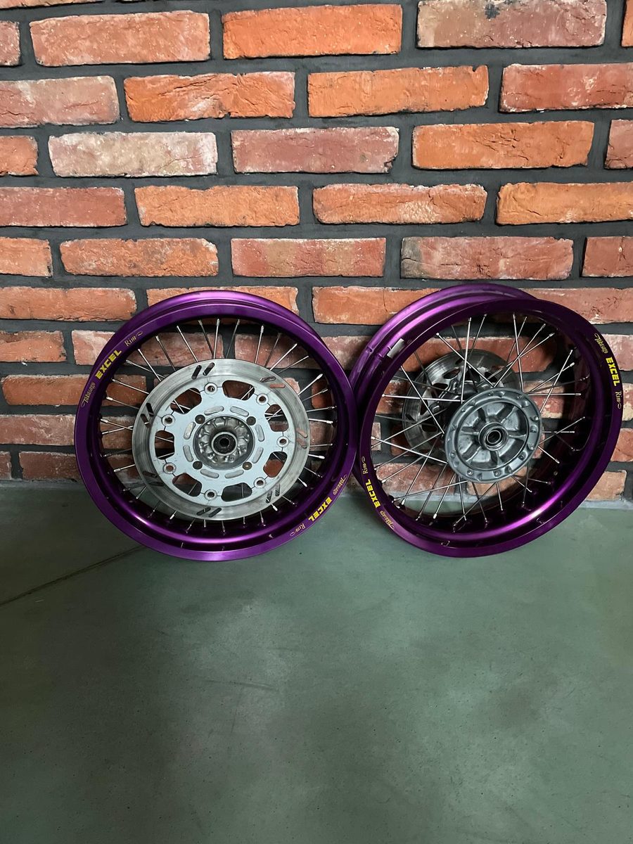 Two Yamaha XT 660 wheels with purple Excel rims on the original hubs