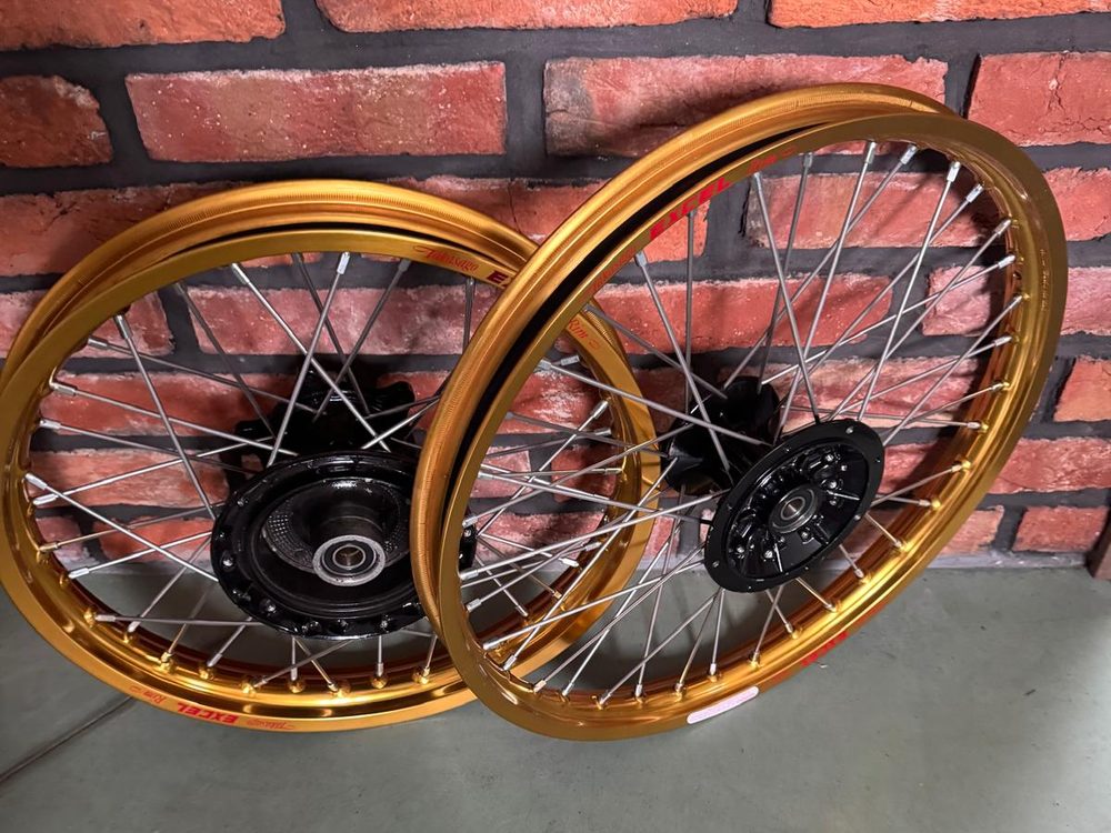 Two Yamaha XT 600 wheels with gold Excel rims and black hubs