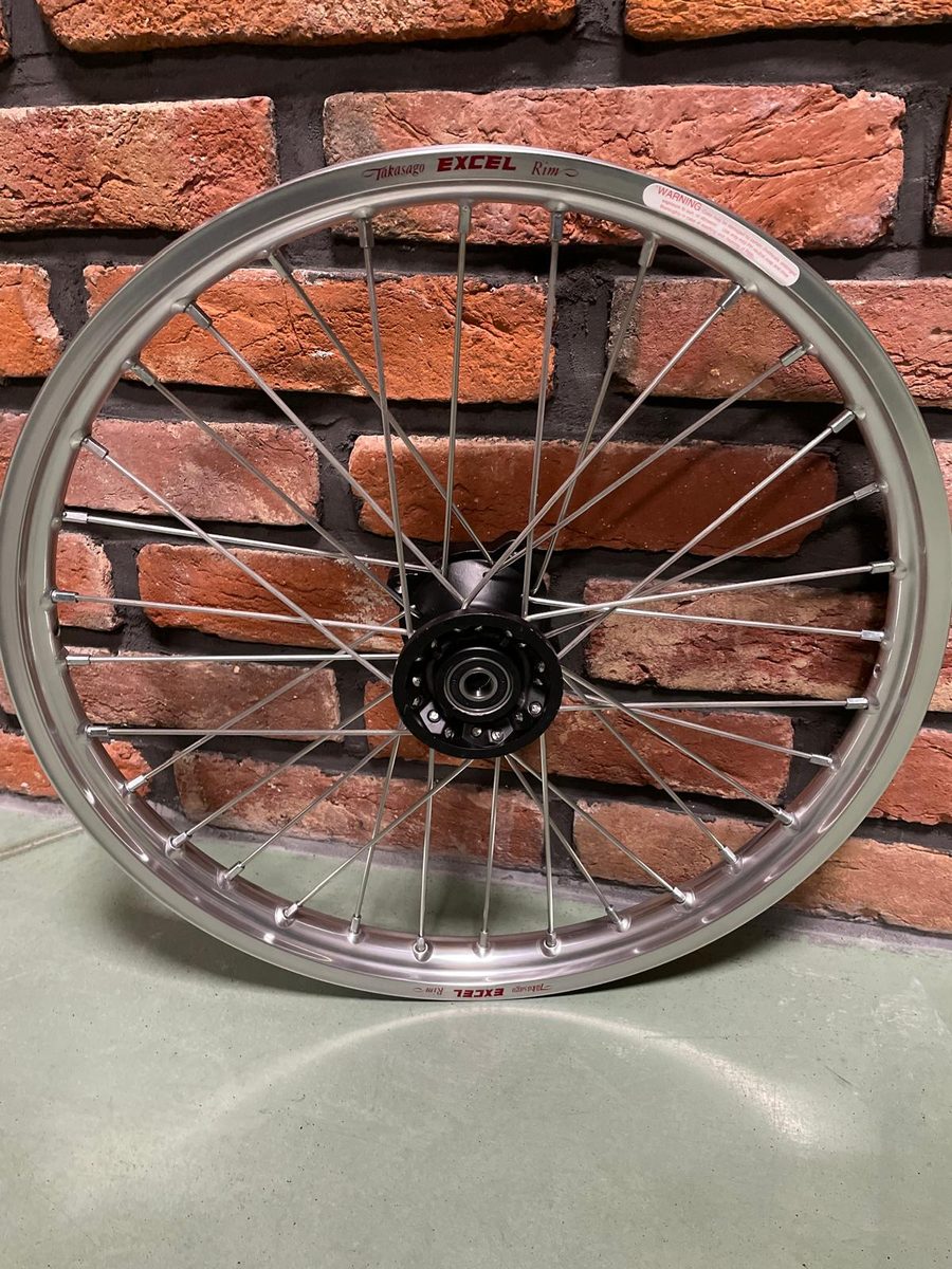 Suzuki DR wheel with a silver Excel rim and a black hub