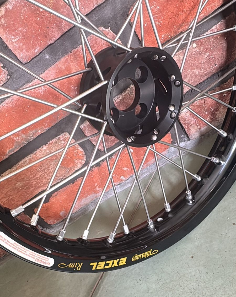 Trike project wheel with a black Excel rim and stainless spokes